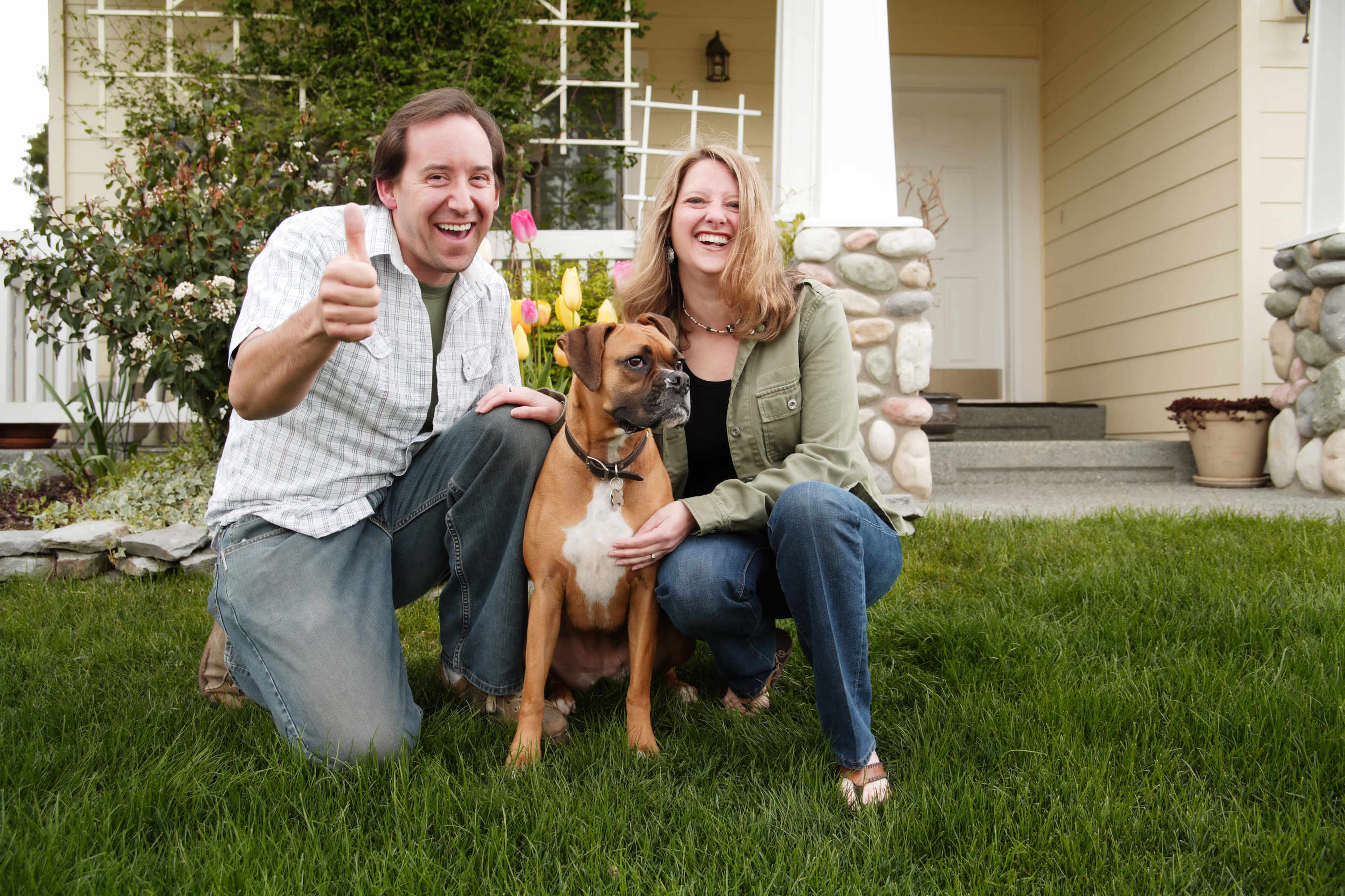 Happy Couple at Home with Dog